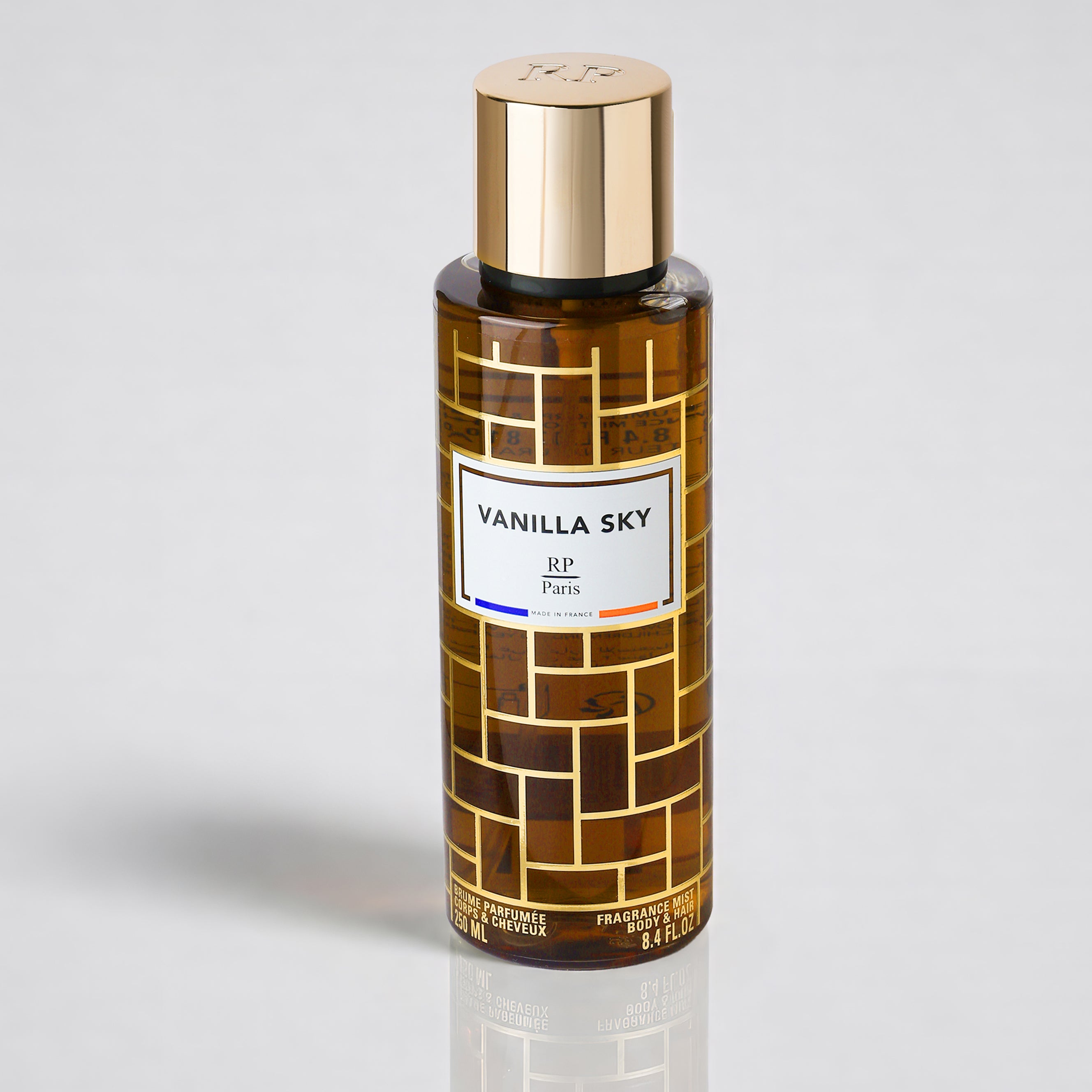 Vanilla Sky perfume bottle with gold cap on a light gray background
