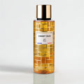Bottle of 'Sweet Oud' perfume by RP Paris on a light gray background