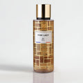 Perfume bottle labeled 'Pink Lady' with gold cap on a light gray background