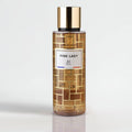 Perfume bottle labeled 'Pink Lady' with gold cap on a light gray background