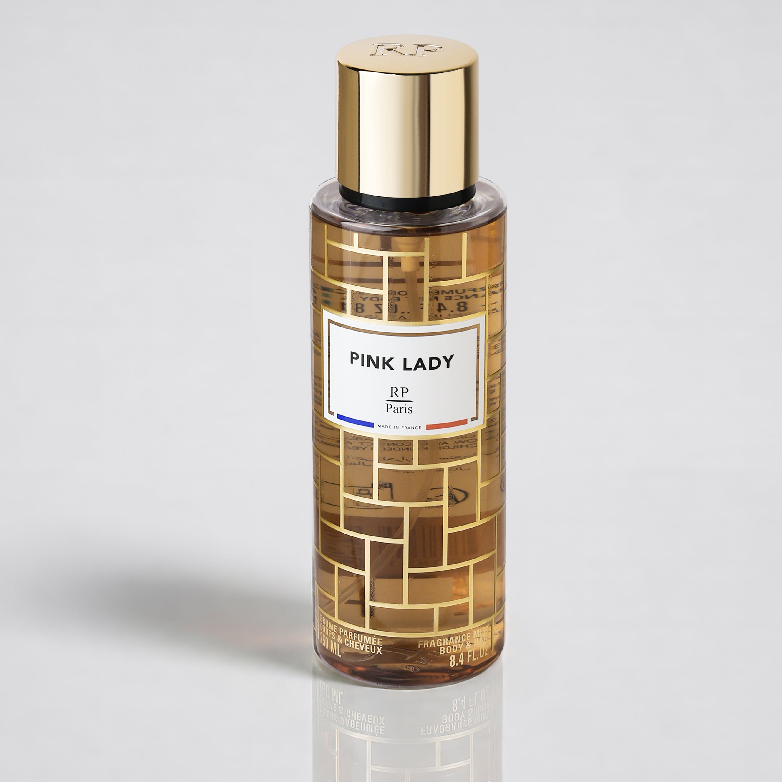 Perfume bottle labeled 'Pink Lady' on a light gray background