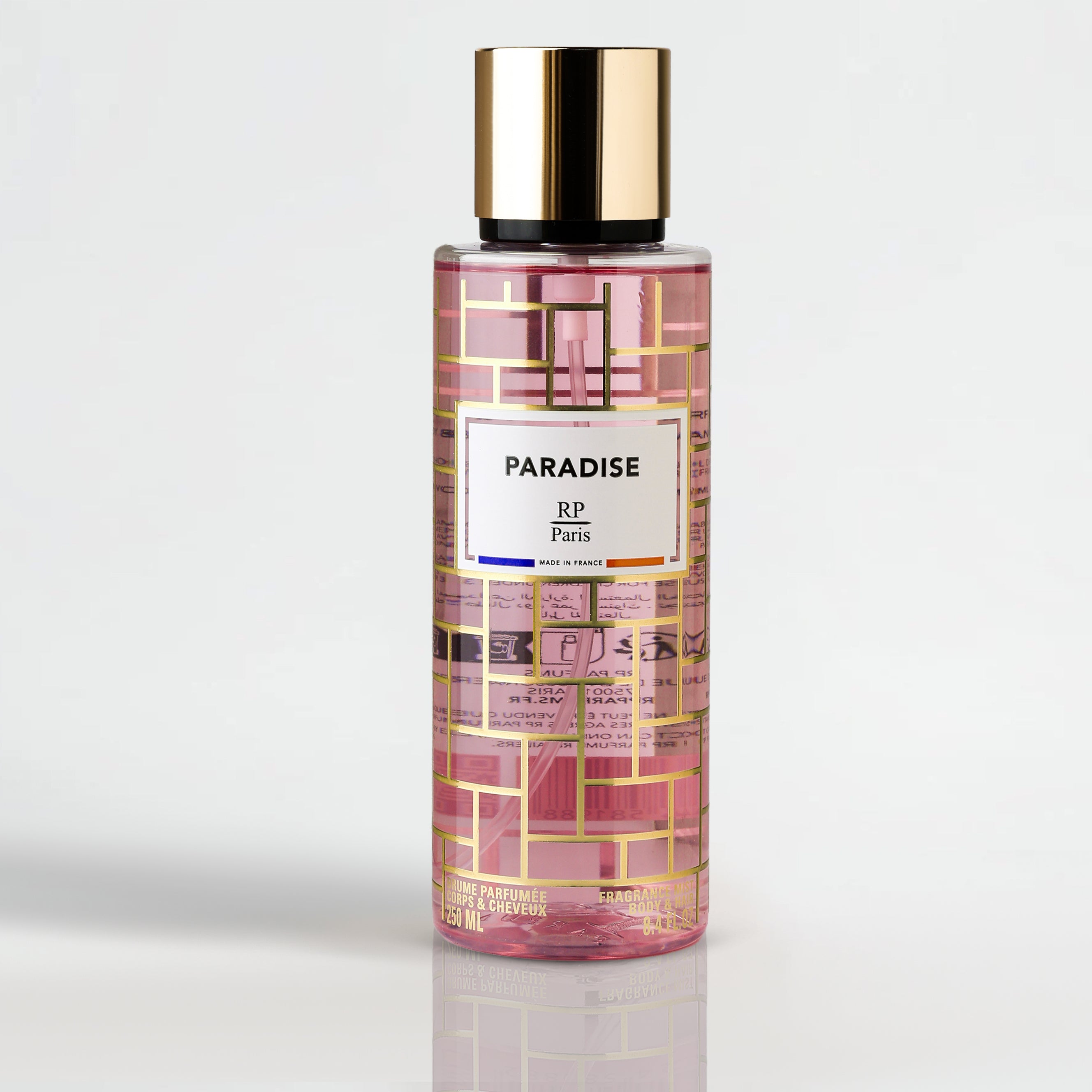 Perfume bottle labeled 'Paradise RP Paris' on a light gray background
