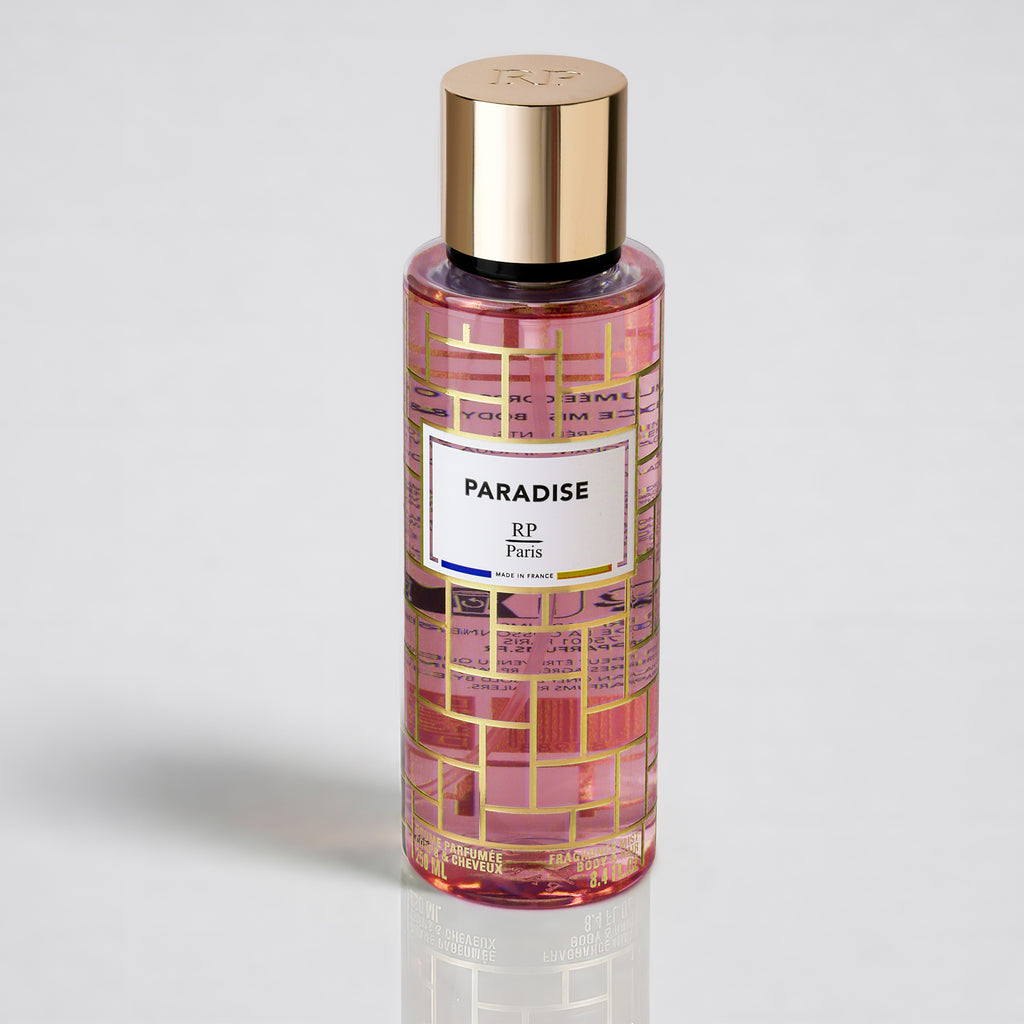 Perfume bottle labeled 'Paradise' with gold cap on a light gray background