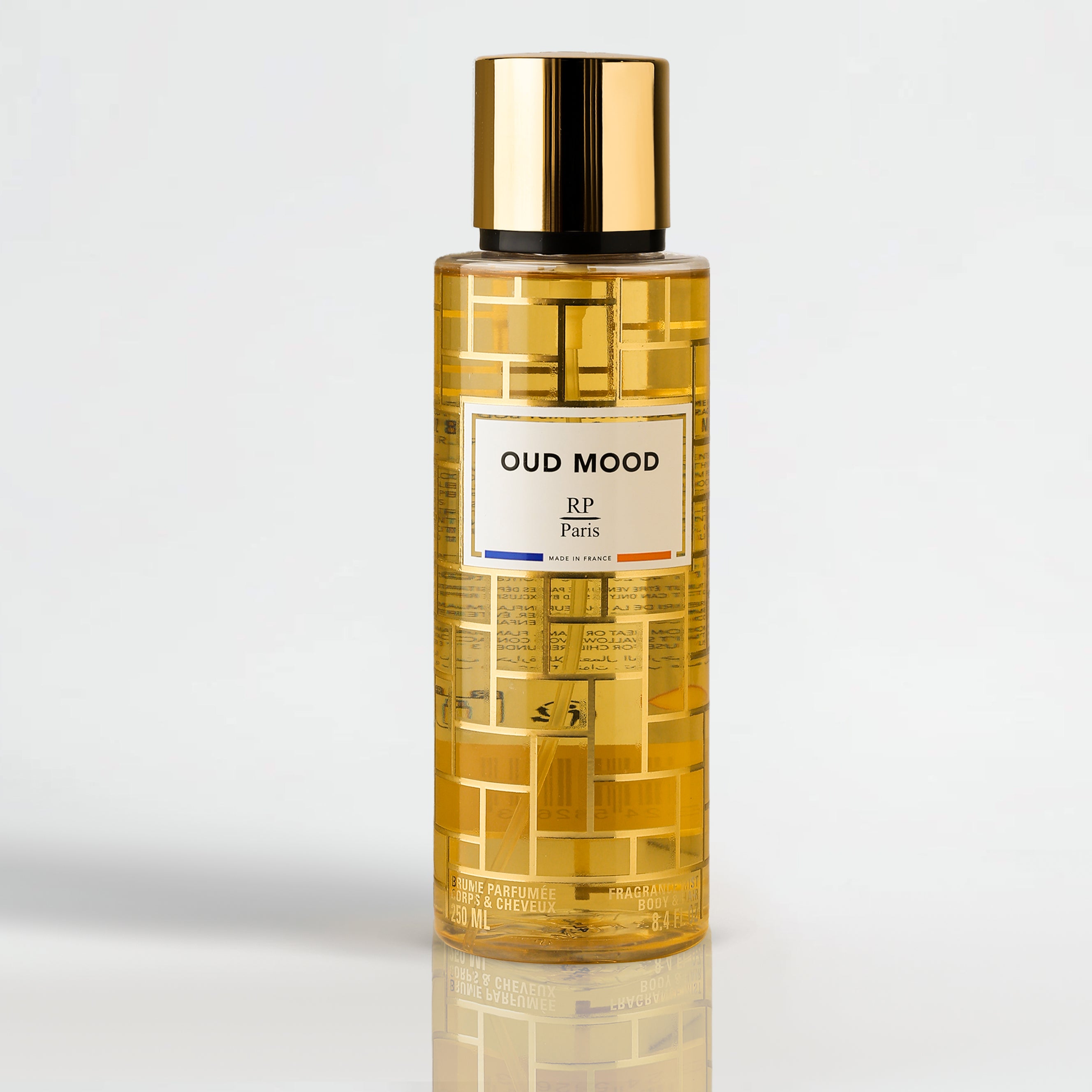 Bottle of Oud Mood RP Paris on a light gray background