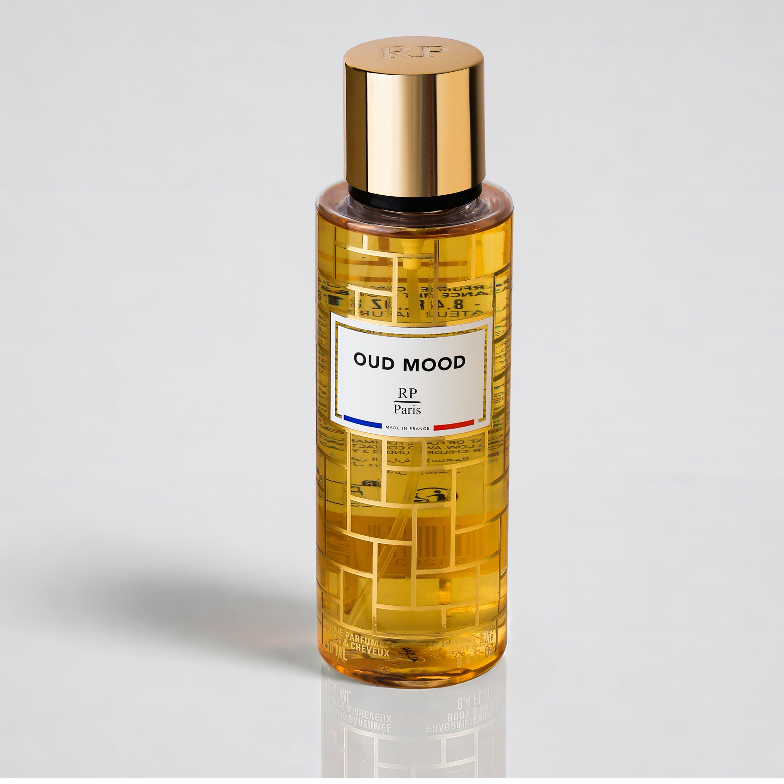 Bottle of Oud Mood perfume by RP Paris on a light gray background