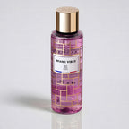 Pink bottle with gold cap labeled 'Miami Vibes' on a light gray background