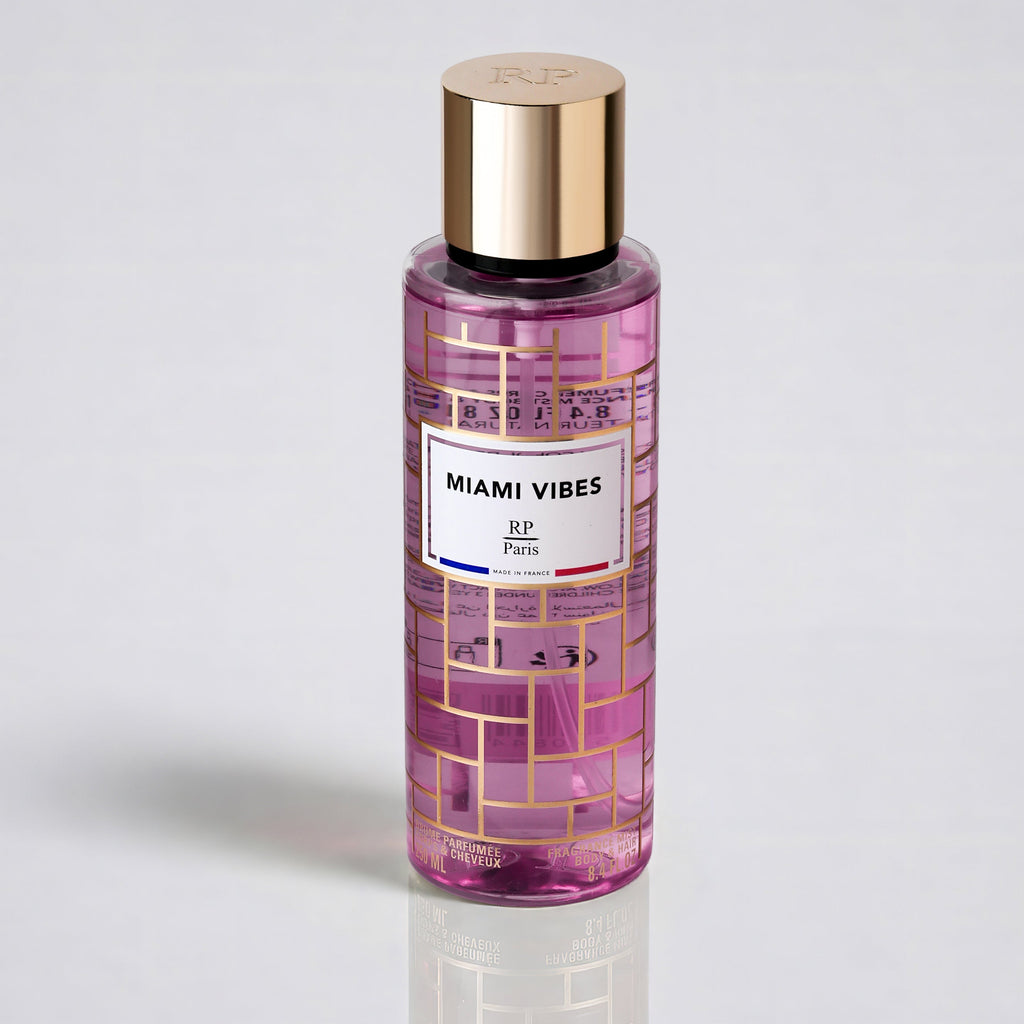 Pink bottle with gold cap labeled 'Miami Vibes' on a light gray background