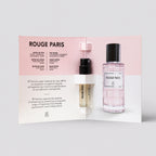 Rouge Paris perfume bottles with packaging on a light gray background