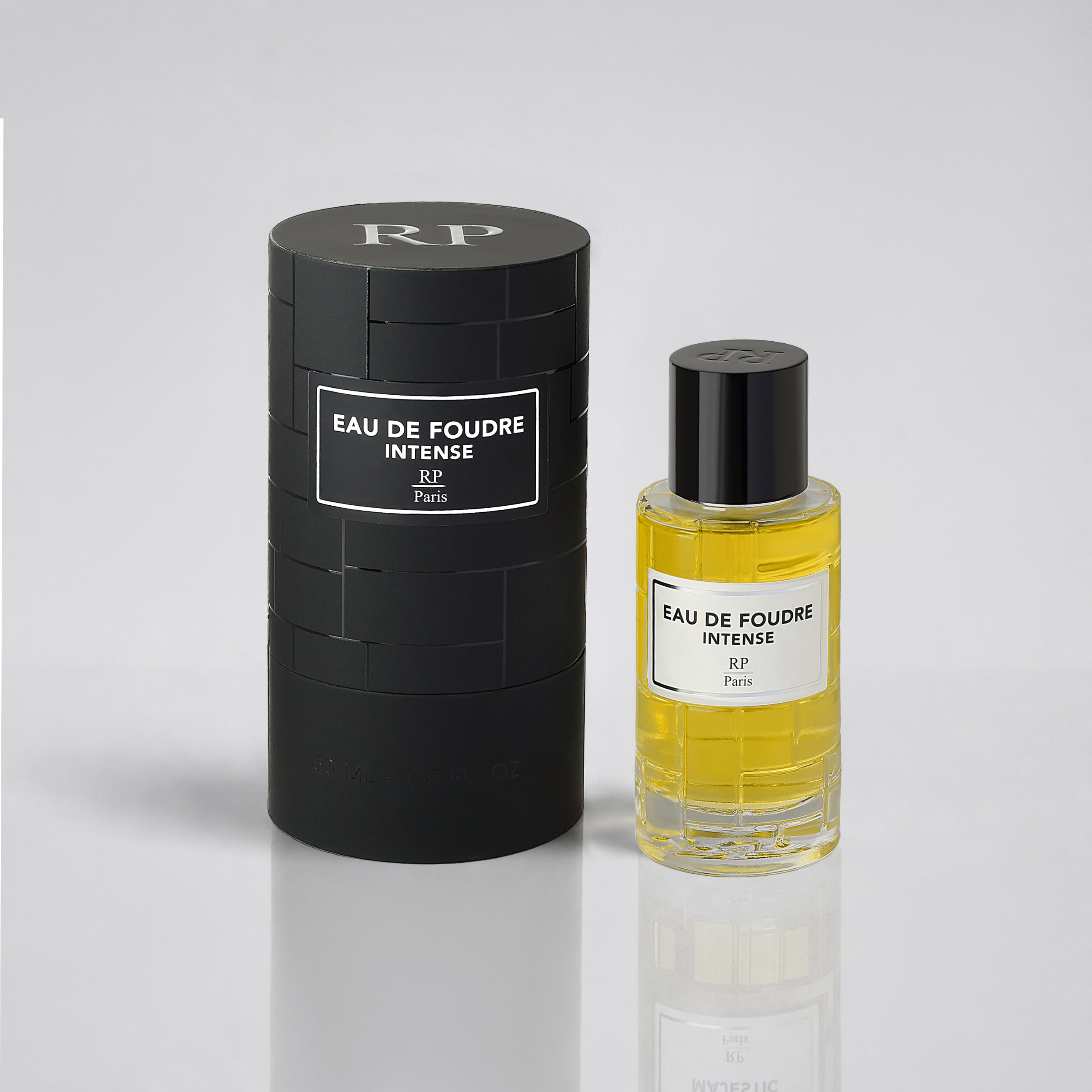 Perfume bottle and packaging labeled 'Eau de Foudre Intense' on a light gray background