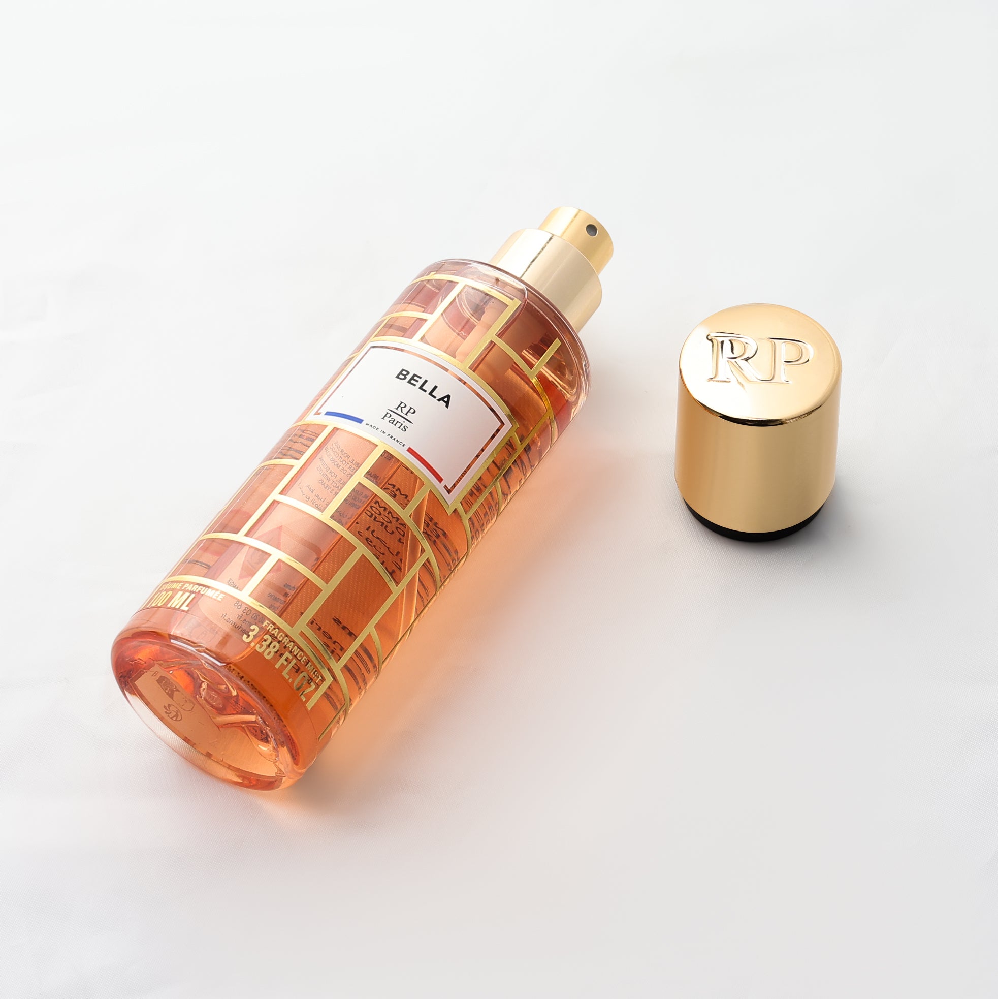 Bella skincare bottle with gold cap on a white background