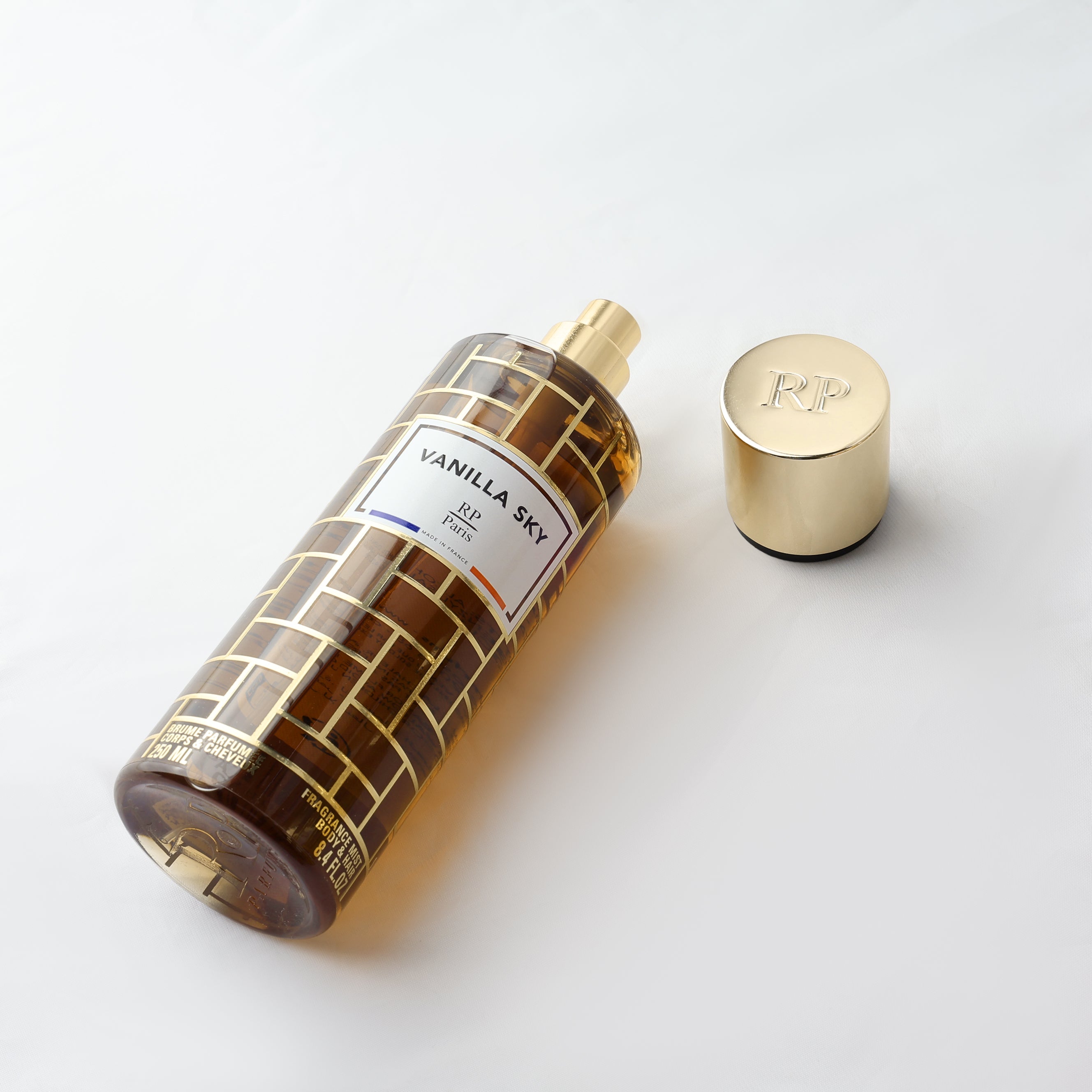 Perfume bottle labeled 'Vanilla Sky' by R&F on a white background