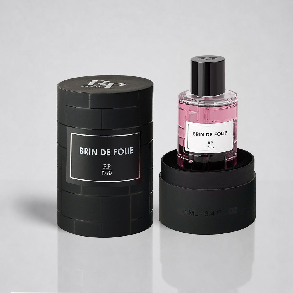 Perfume bottle and packaging of 'Brin de Folie' by RP Paris on a light gray background