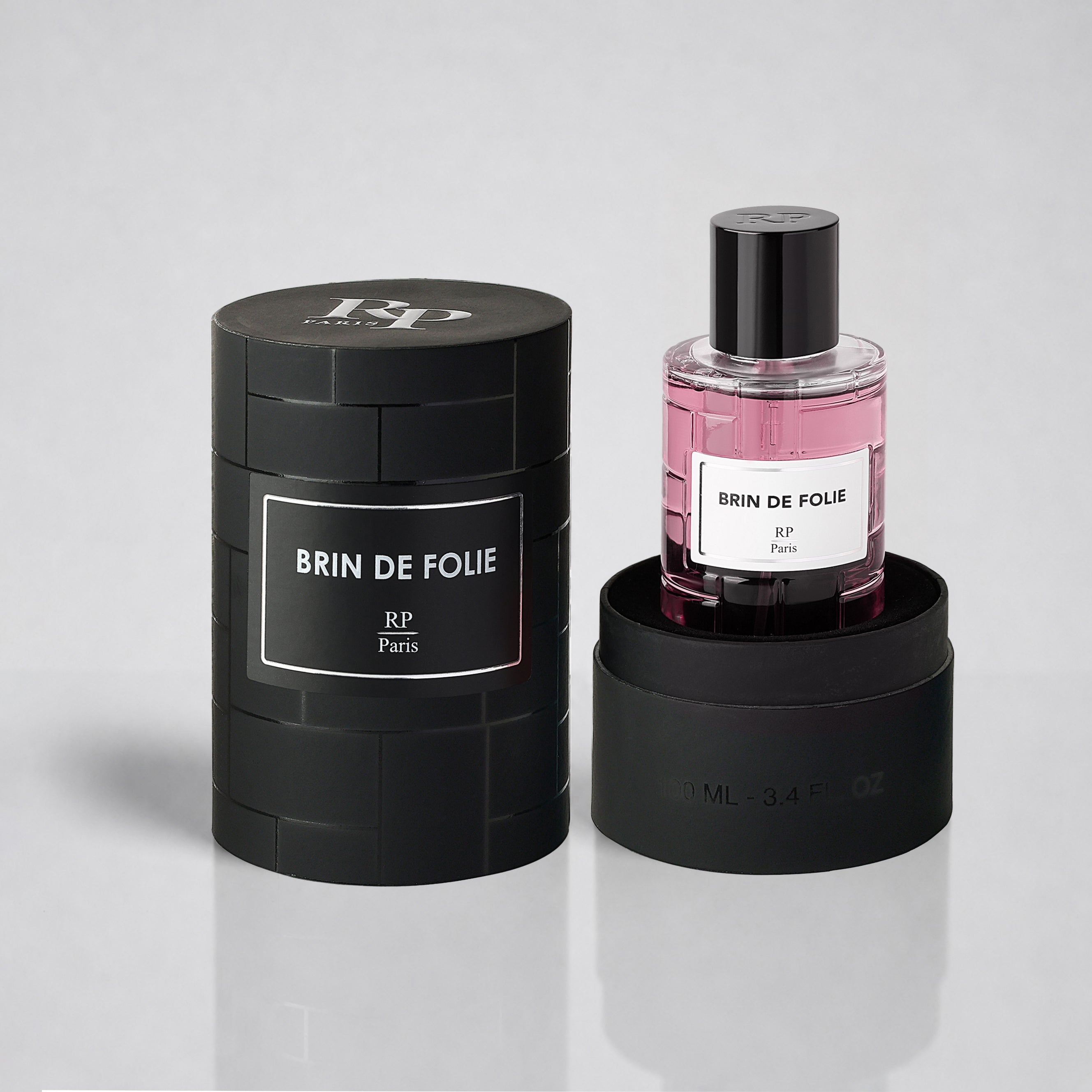 Perfume bottle and packaging of 'Brin de Folie' by RP Paris on a light gray background