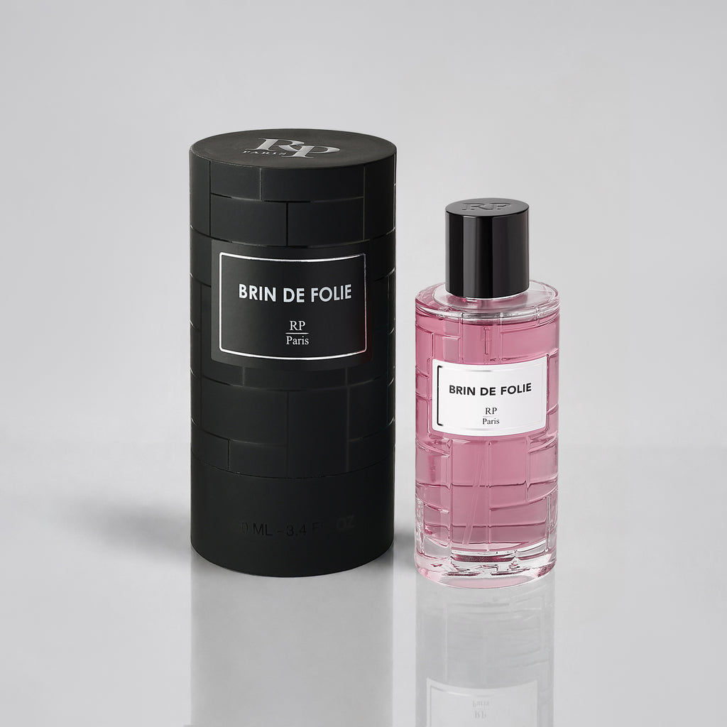Brin de Folie perfume bottle and packaging on a light gray background