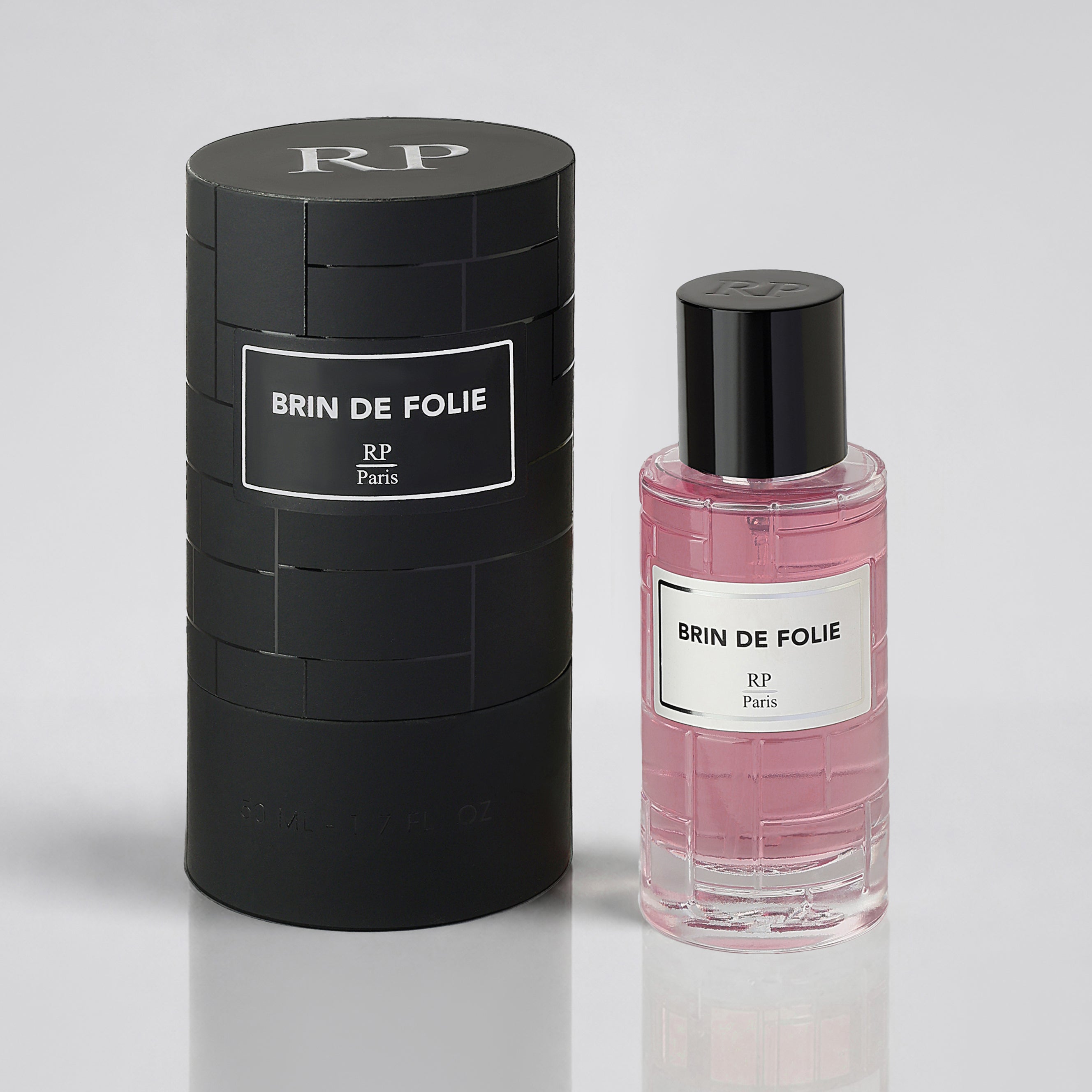 Perfume bottle and packaging of 'BRIN DE FOLIE' by RP Paris on a light gray background