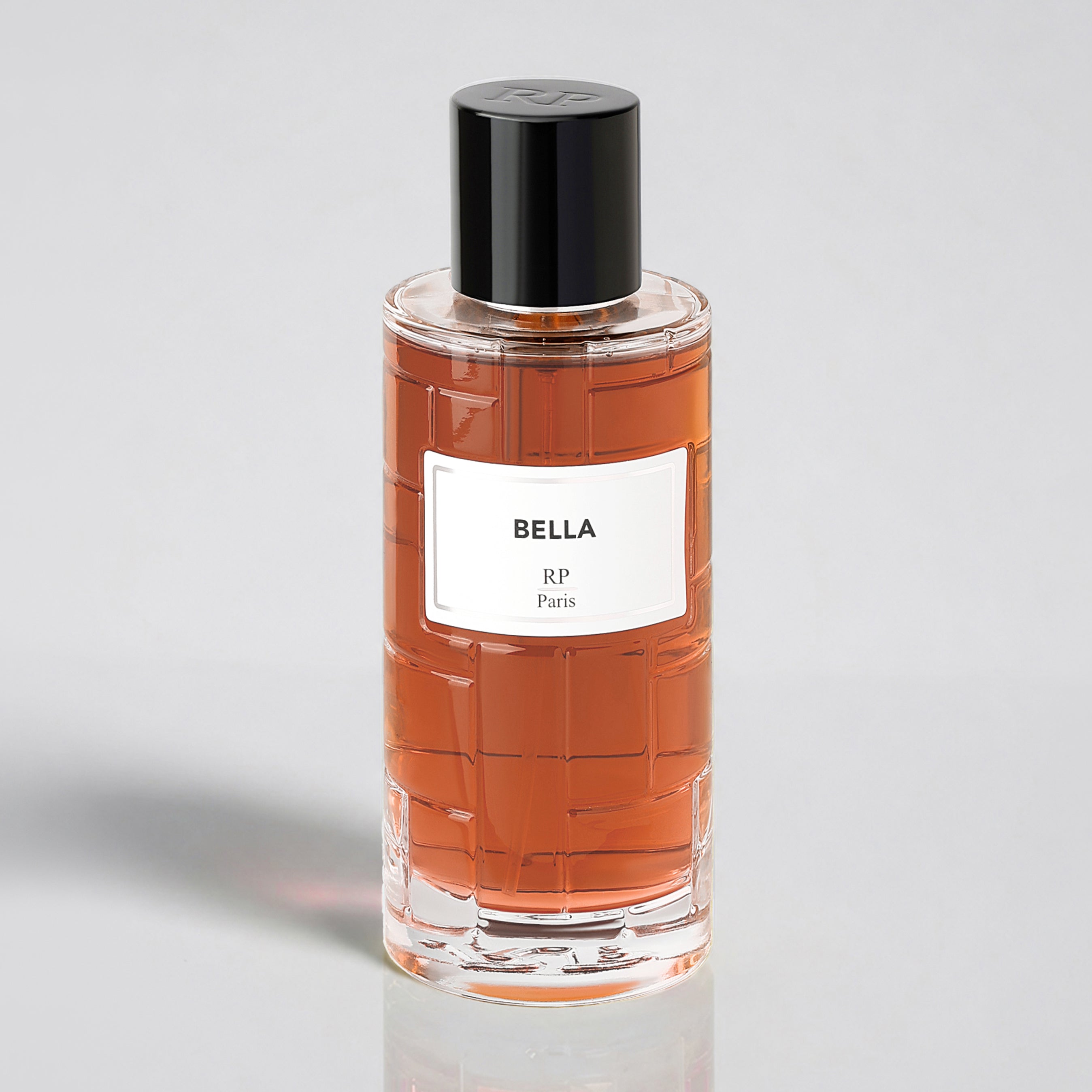 Perfume bottle labeled 'Bella' by RP Paris on a light gray background