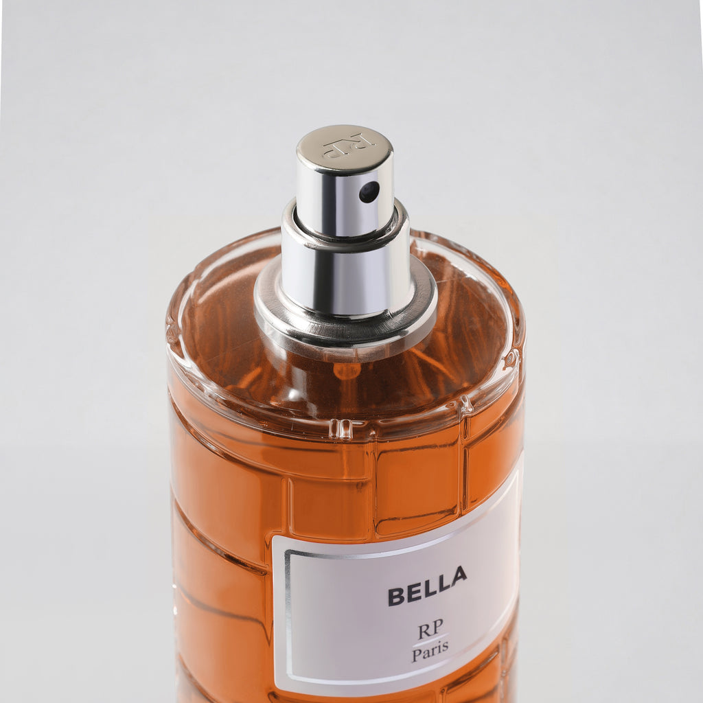 Perfume bottle labeled 'Bella' by RP Paris on a white background