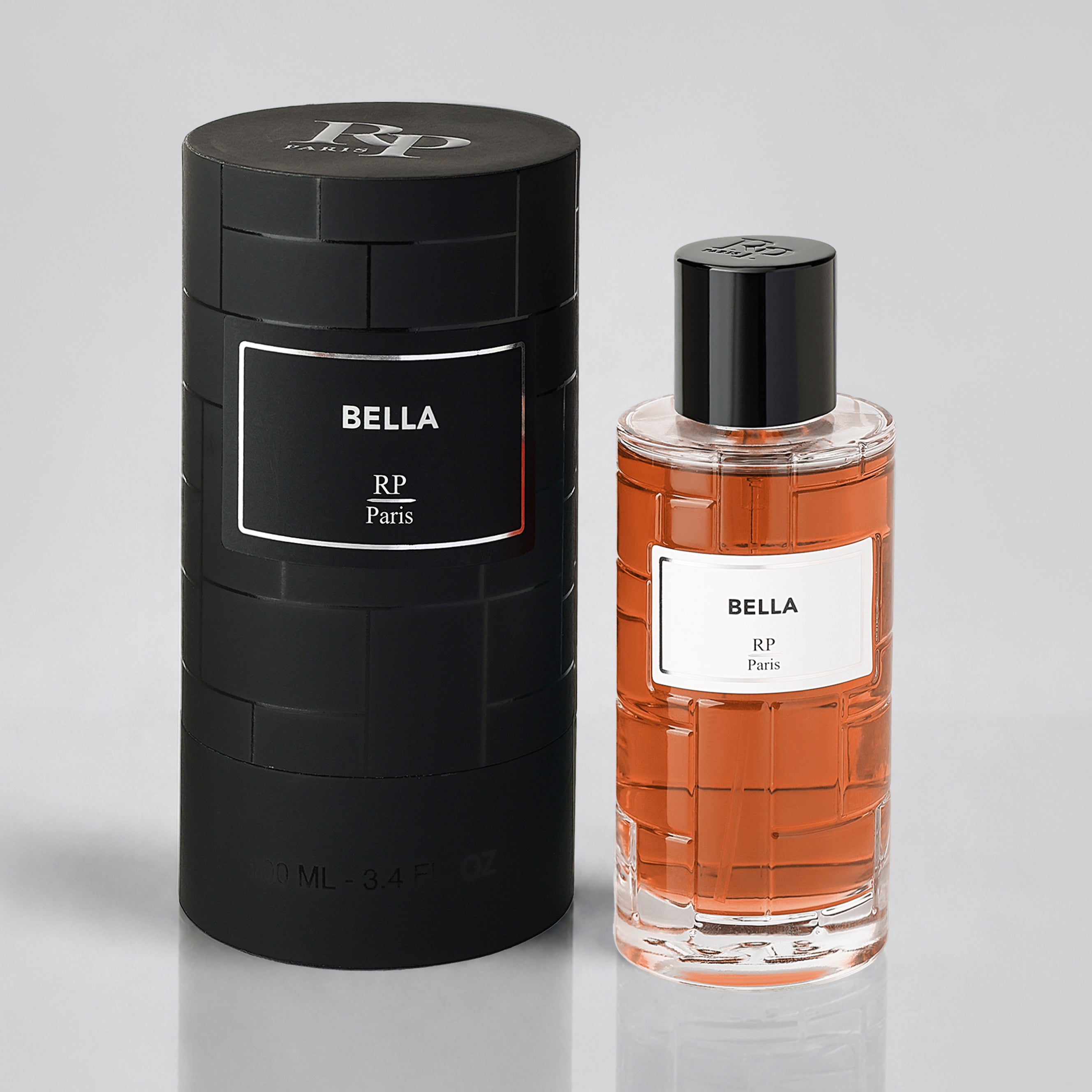 Perfume bottle and packaging of 'Bella' by RP Paris on a light gray background