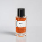 Perfume bottle labeled 'Bella RP Paris' on a light gray background