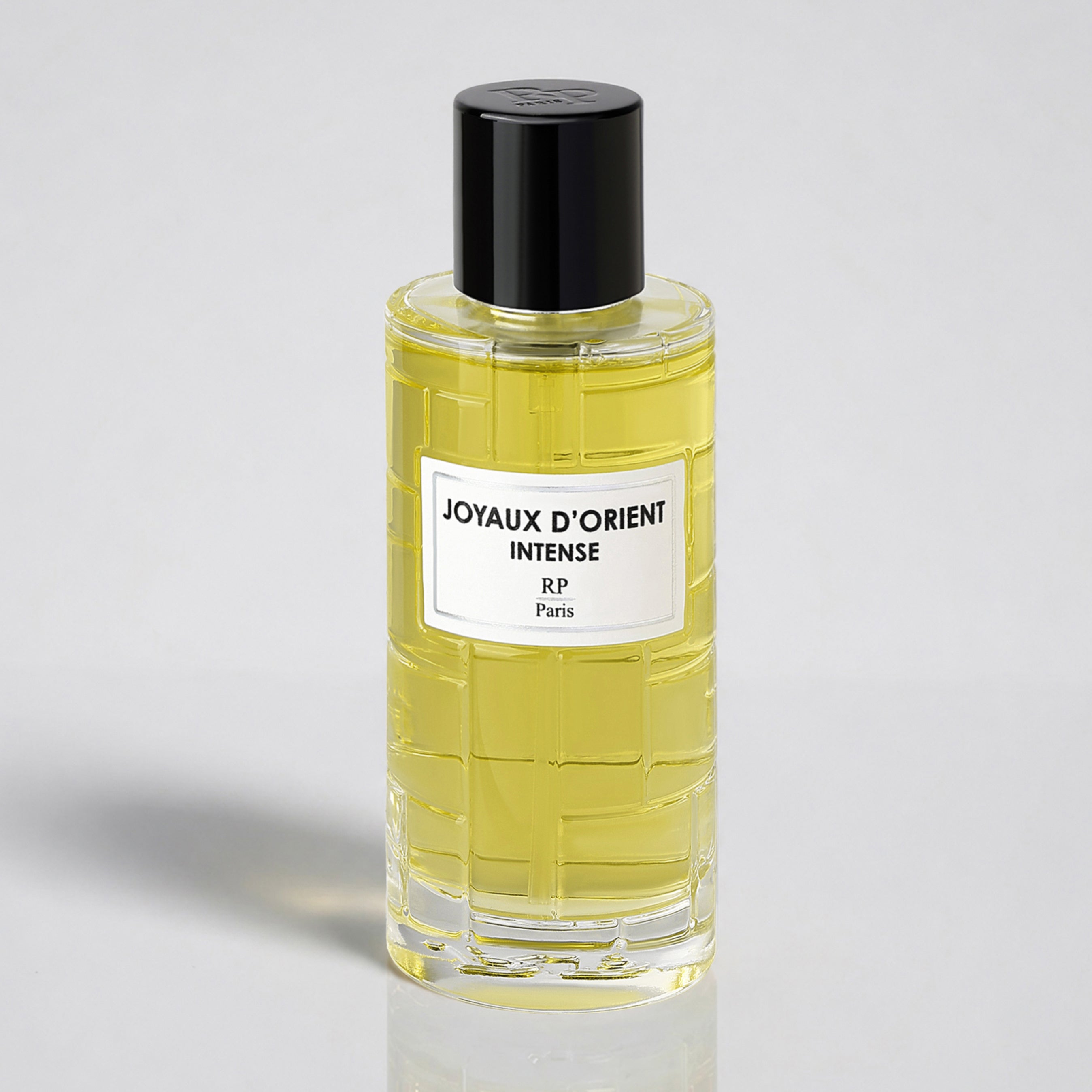 Perfume bottle labeled 'Joyaux d'Orient Intense' by RP Paris on a light gray background