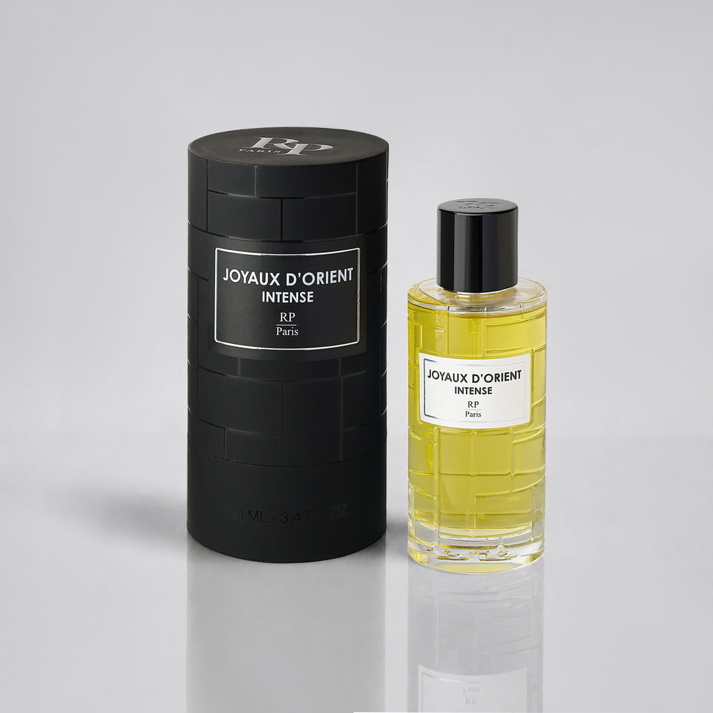 Perfume bottle and packaging of 'Joyaux d'Orient Intense' by RP Paris on a light gray background
