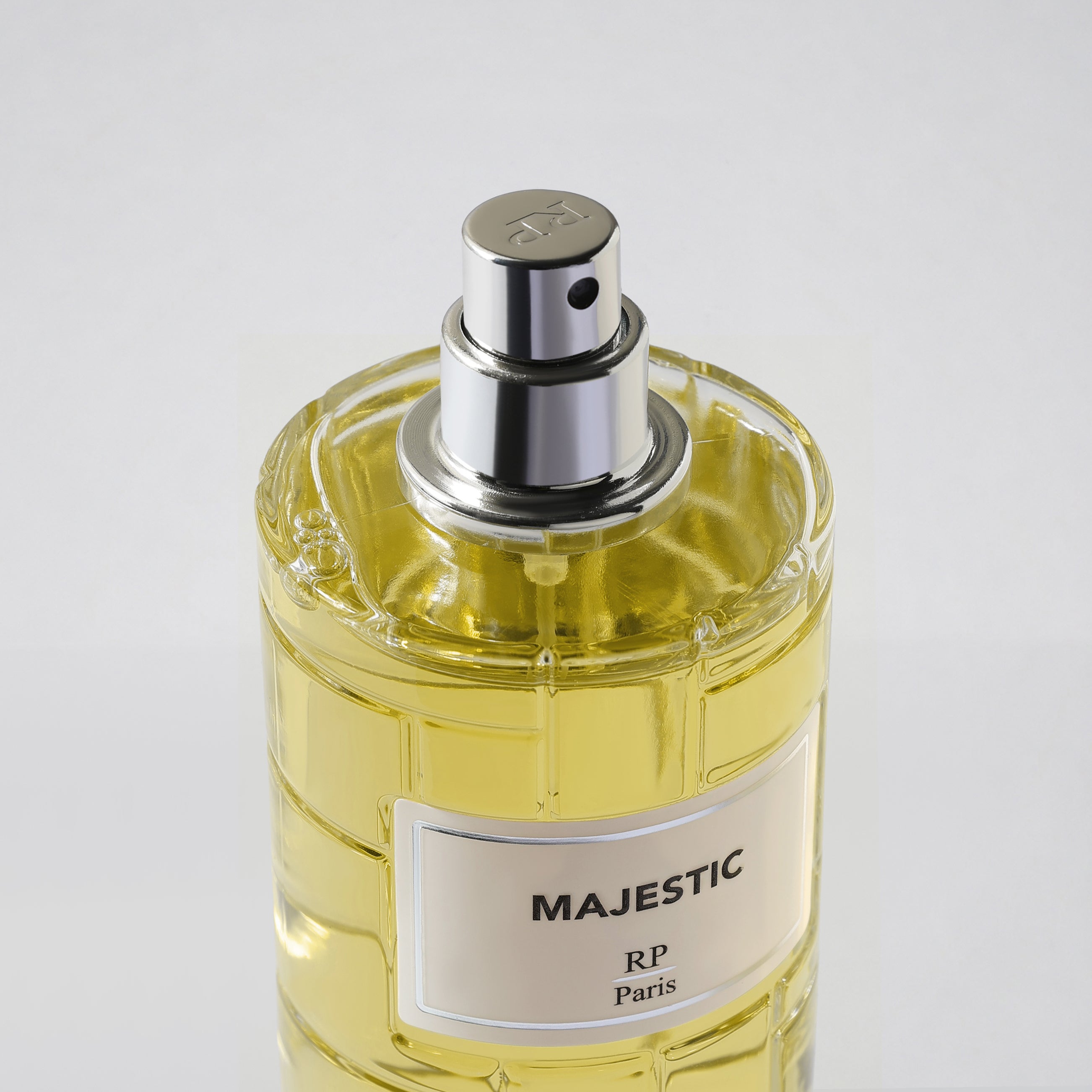 Perfume bottle labeled 'Majestic RP Paris' on a white background