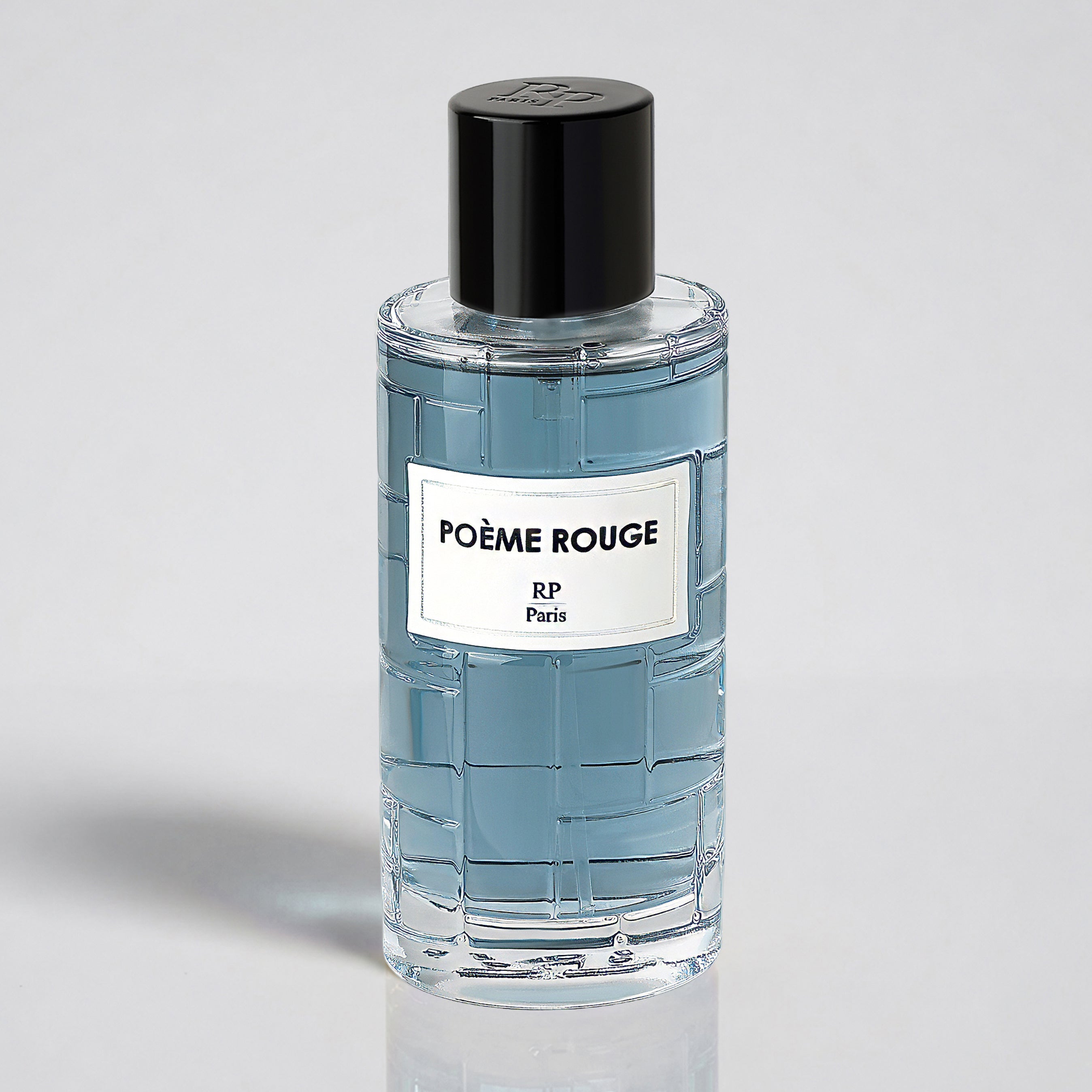 Perfume bottle labeled 'Poème Rouge' on a gray background