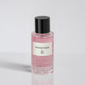 Pink perfume bottle with black cap and 'Rouge Paris' label on a light gray background