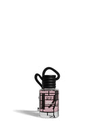 A small clear bottle of RP Lady Wonder perfume with a black cap and a black-and-pink geometric label, shown on a plain white background.FraiseDesBois