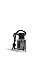 A small clear bottle with a black cap and black cord keychain, featuring a black geometric grid pattern on the label. The label reads 'RP' and 'MOSC PENSADO'.
