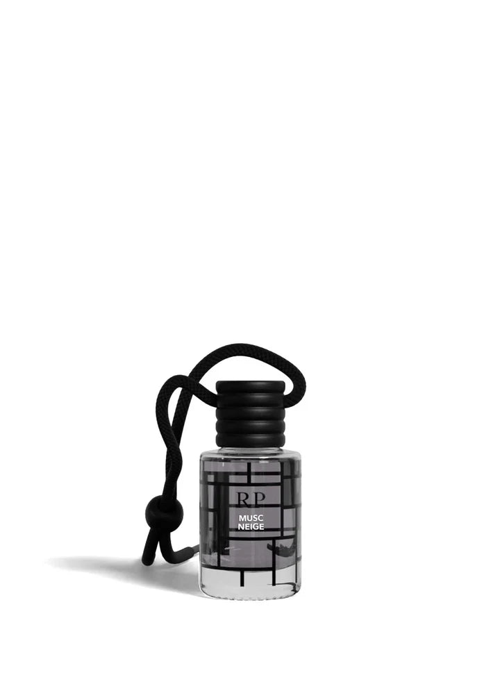 A small clear bottle with a black cap and black cord keychain, featuring a black geometric grid pattern on the label. The label reads 'RP' and 'MOSC PENSADO'.