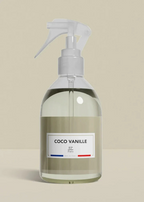 Clear spray bottle labeled 'Coco Vanille' on a beige background