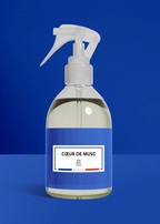 Clear spray bottle with a blue label on a blue background