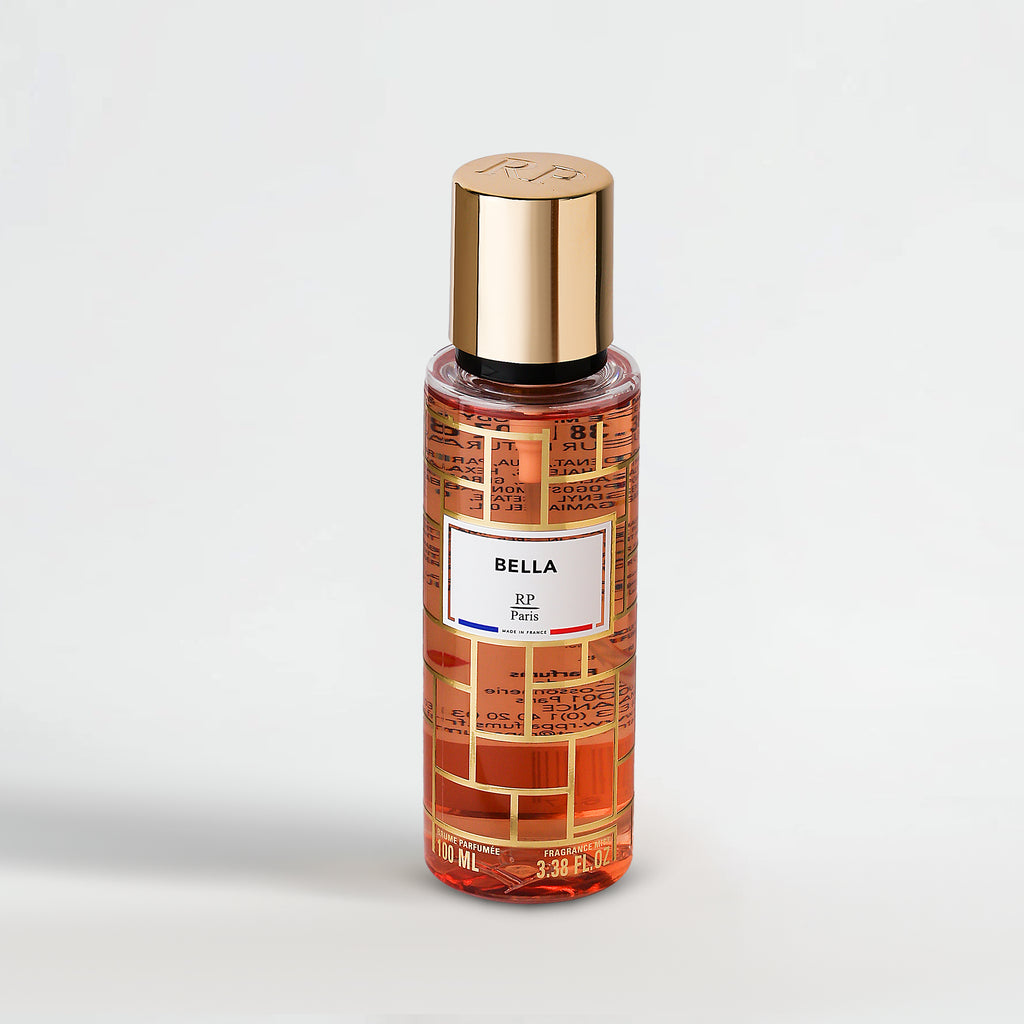 Perfume bottle labeled 'Bella' with gold cap on a light gray background