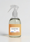 RP PARIS Bouquet Royal scented fabric spray in a clear bottle with a white trigger sprayer on a tan background.