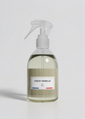 RP PARIS Coco Vanille scented fabric spray in a clear bottle with a minimalist label and trigger sprayer