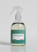 RP PARIS Cotton Dream scented fabric spray in a clear bottle with a white trigger sprayer on a green background.