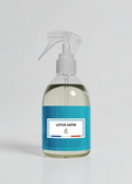 RP PARIS Lotus Satin scented fabric spray in a clear bottle with a blue label, made in France.