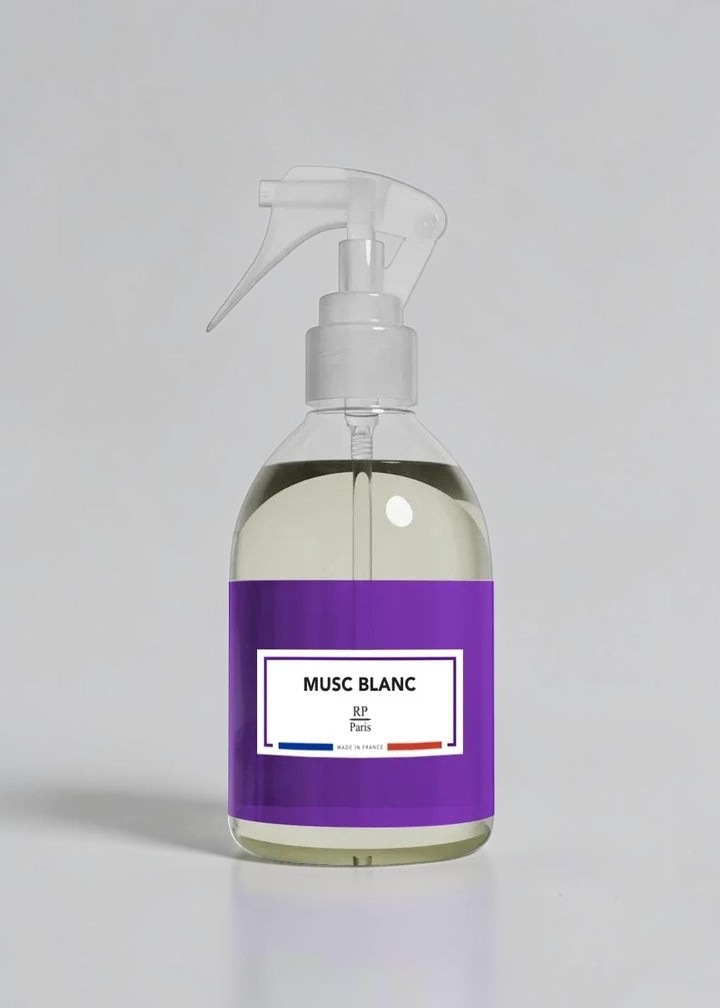 RP PARIS Musc Blanc scented fabric spray in a clear bottle with a purple label, made in France.