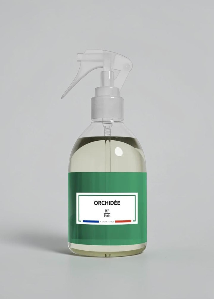 RP PARIS Orchidée scented fabric spray in a clear bottle with a green label, designed for home fragrance.
