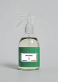 RP PARIS Orchidée scented fabric spray in a clear bottle with a green label, designed for home fragrance.