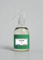 RP PARIS Orchidée scented fabric spray in a clear bottle with a green label, designed for home fragrance.