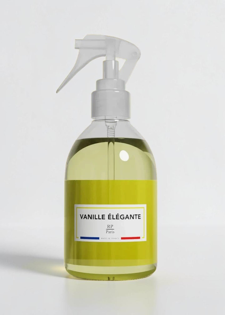 RP PARIS Vanille élégante scented fabric spray in a clear bottle with a yellow label on a matching yellow background.